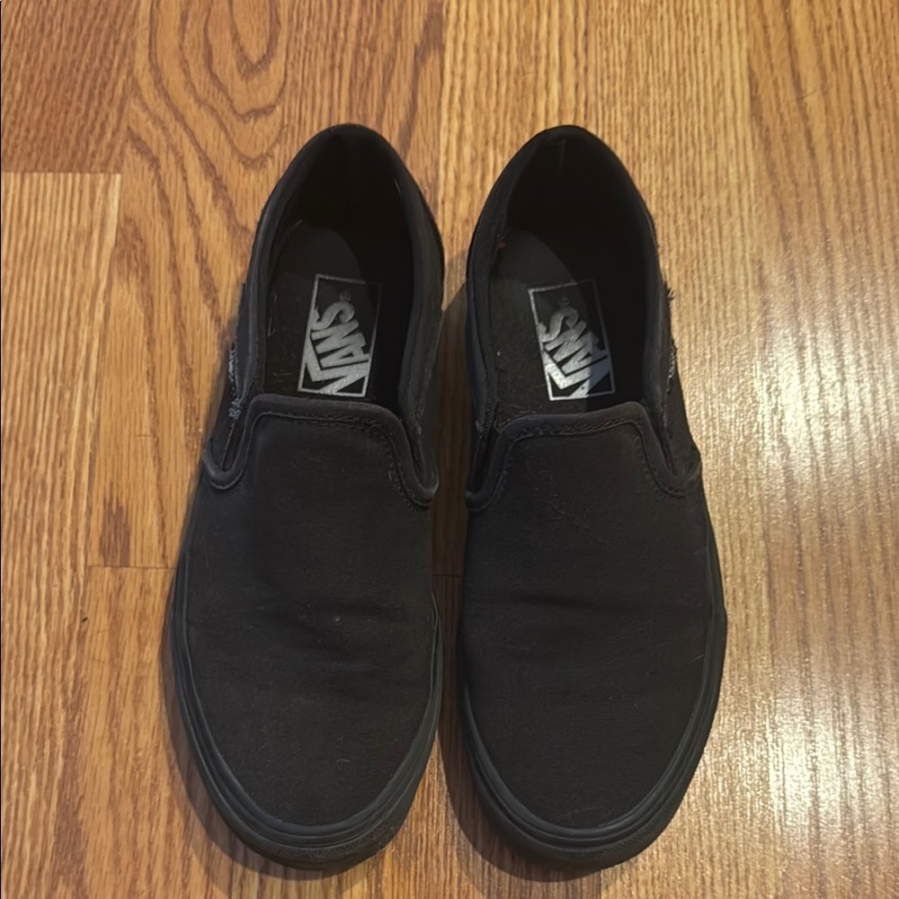 Vans Black Sneakers with Slip-On Design and Textured Fabric